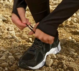 a shoe being laced